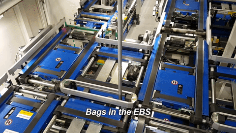 bags moving through automated EBS system