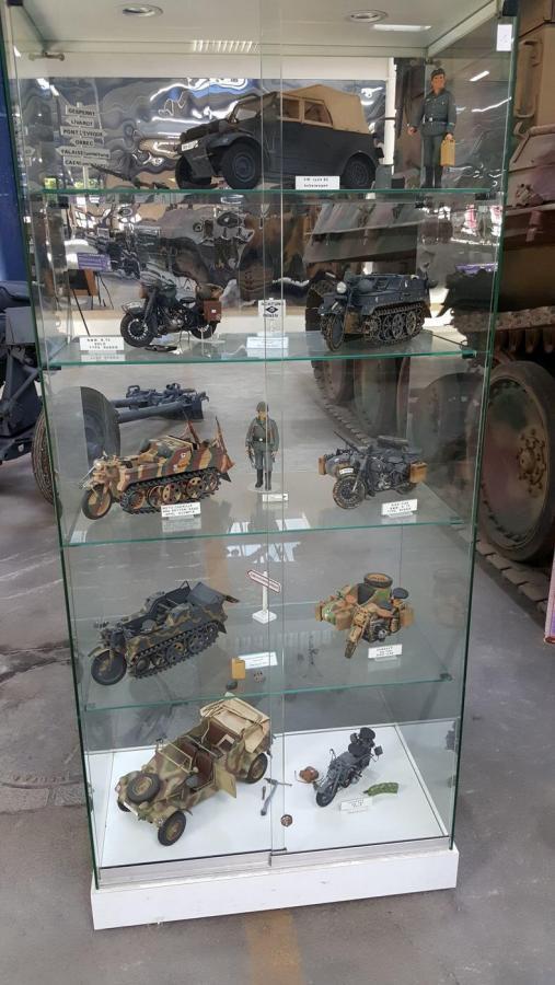 Glass cabinet with model vehicles 