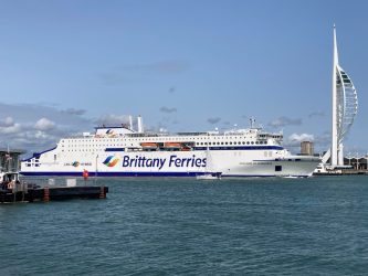 White hulled Brittany Ferries ferry - Guillaume de Normandie - leaving Portsmouth with the Spinnaker tower behind