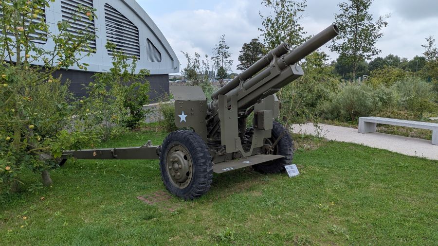 A piece of towed artillery with its barrel raised