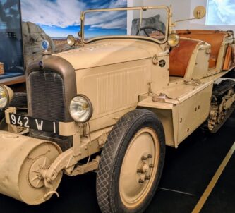 An open top, four seat Citroen P17 half-track car painted in desert brown