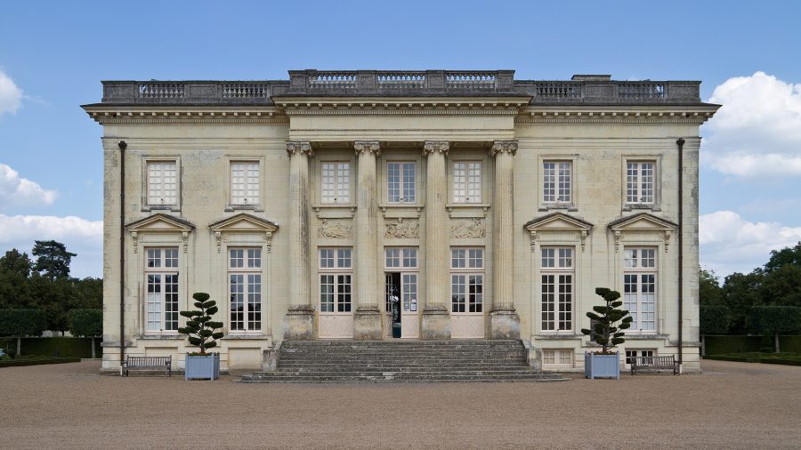 The elegant façade of a large chateau