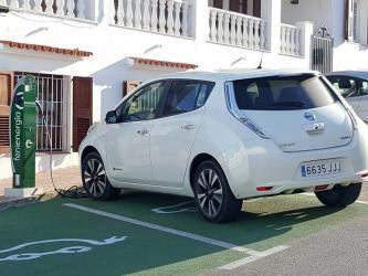 Nissan Leaf electric car being charged at a charging station
