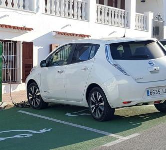 Nissan Leaf electric car being charged at a charging station