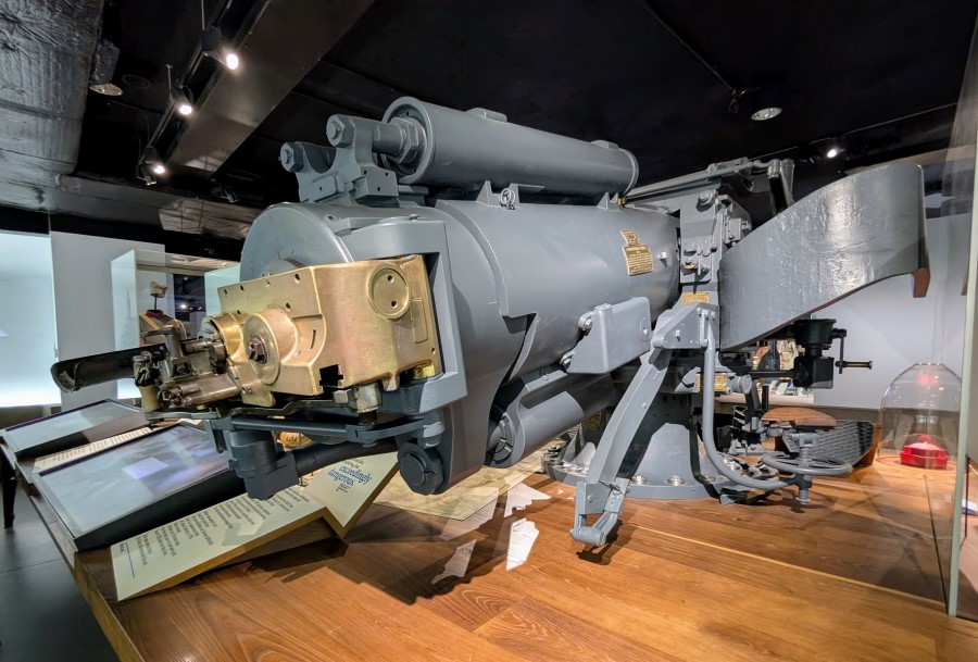 The breech of a large grey naval gun