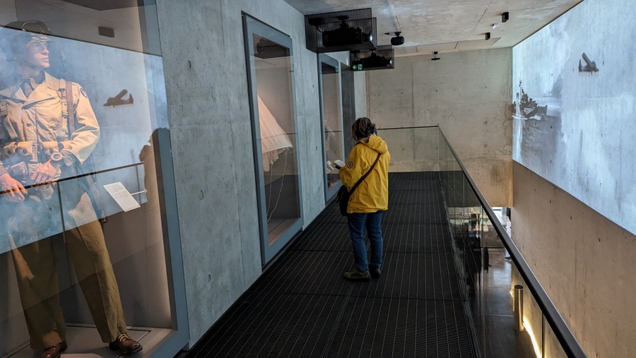 A visitor inspects a display case