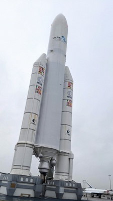 Tall rocket with two booster rockets on the side