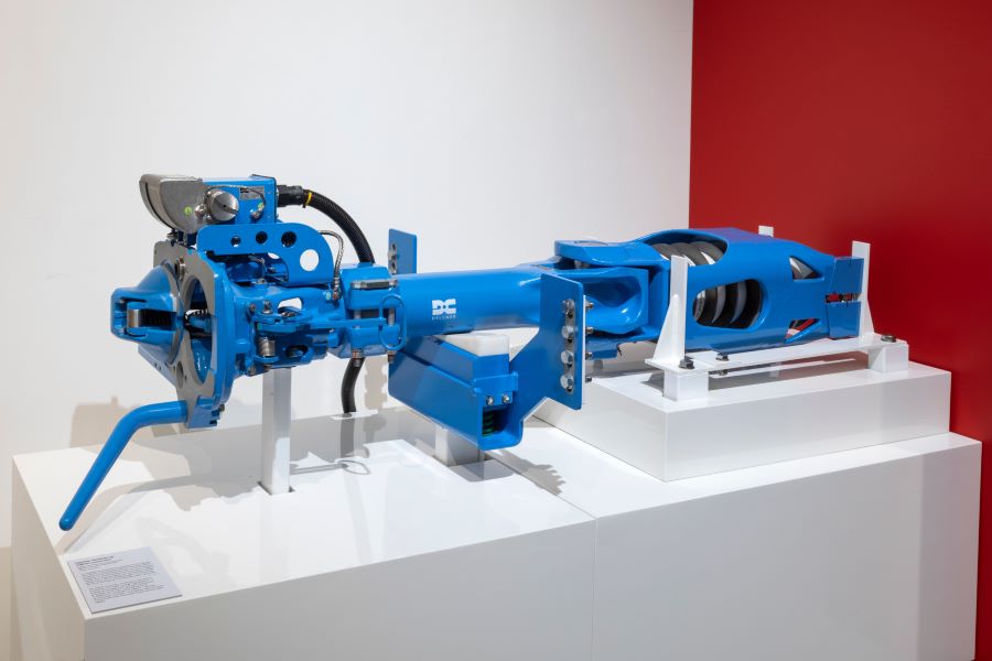 A blue-painted heavy metal train coupling rod