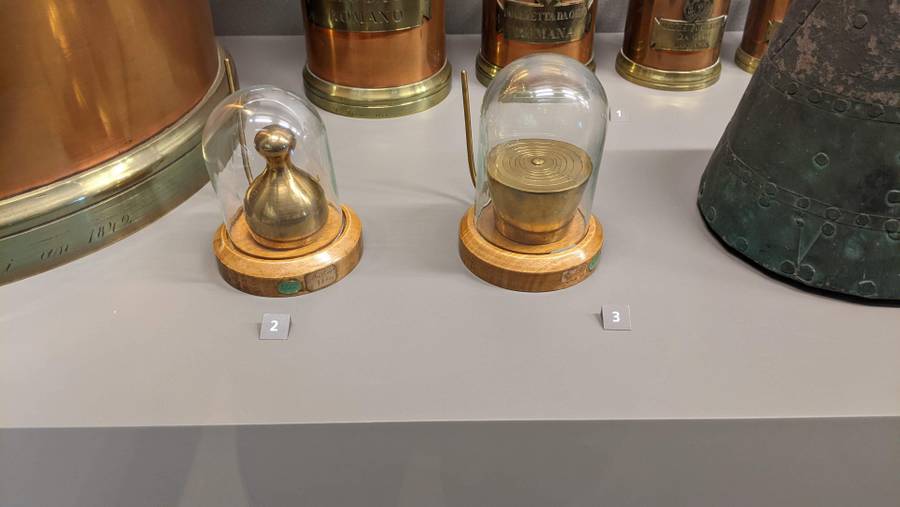 Brass weights inside glass containers