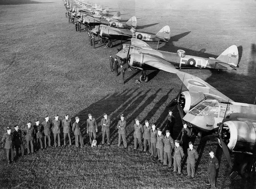 B/W photo of 90 squadron's Blenheim aircraft and crews lined up on RAF Bicester's airfield