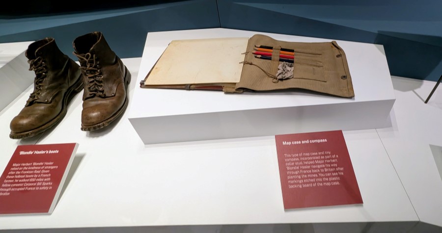 A pair of old boots and a map case belonging to Herbert 'Blondie' Hasler