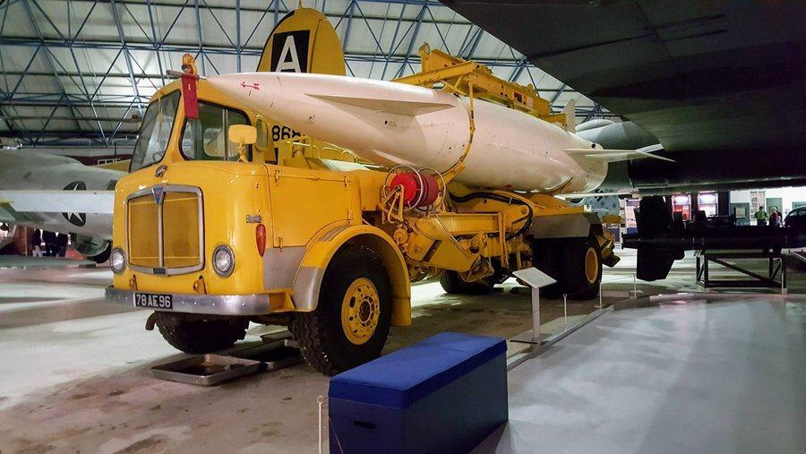 Yellow truck carrying the white missile-shaped bomb