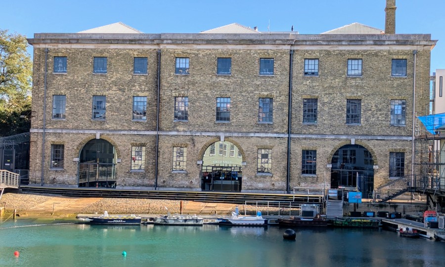 The front of the Royal Marines Experience building, with a small boat basin in front