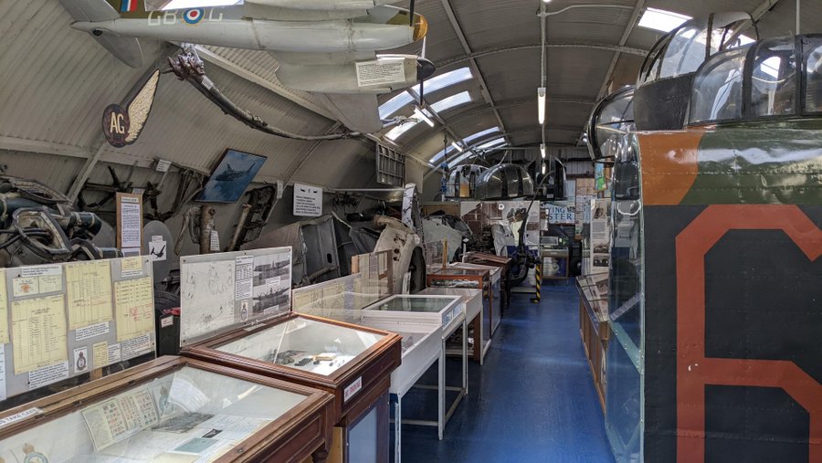 A small gallery with equipment, bomber turrets, photos, memorabilia and models on display
