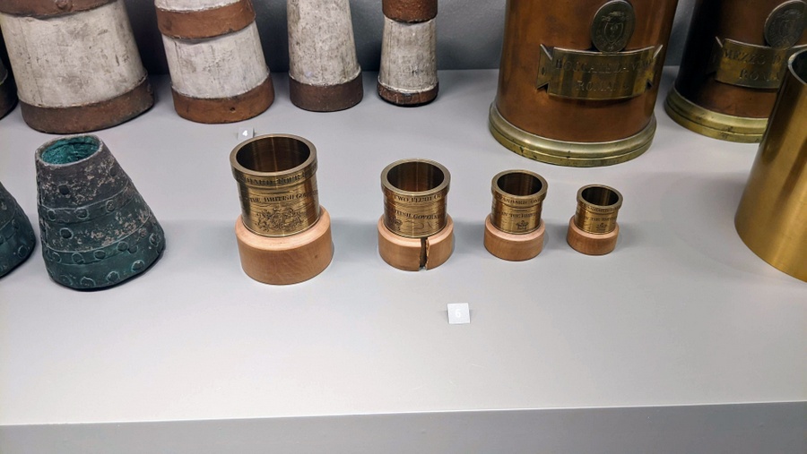 A set of four brass cups