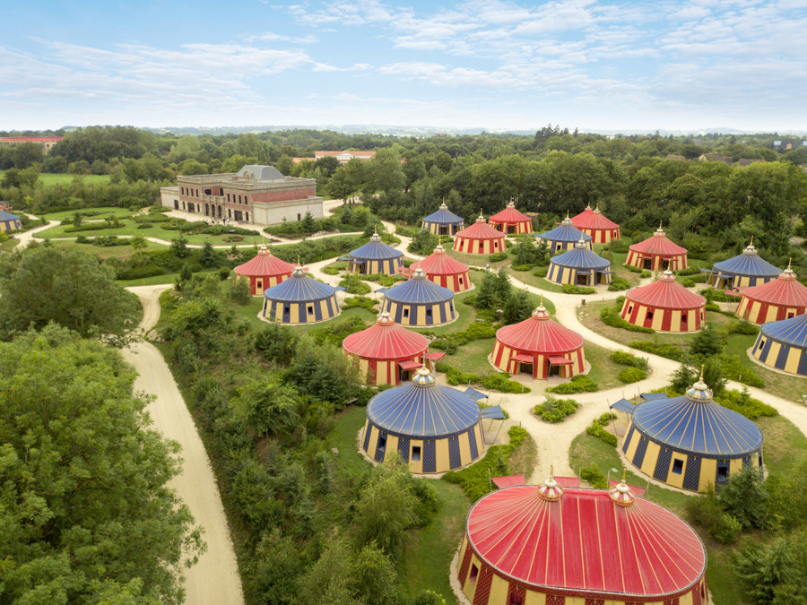 Aerial view of the ornate red and blue tents of the 'Field of the Cloth of Gold'