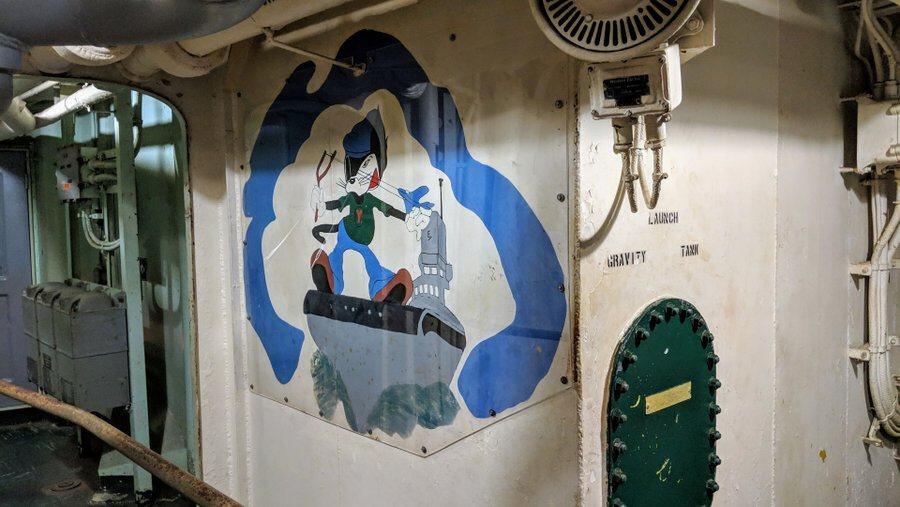 Cartoon character painted on the wall of a ships compartment