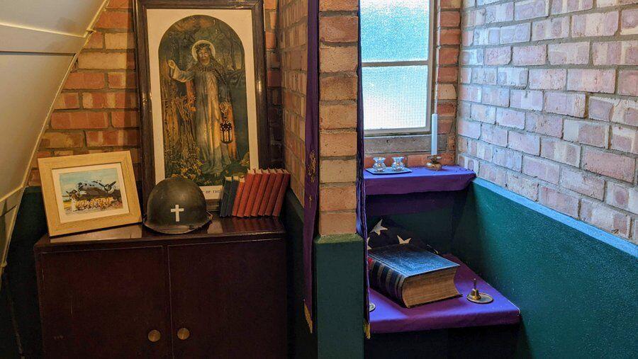 Chaplains room with bible and religious artifacts