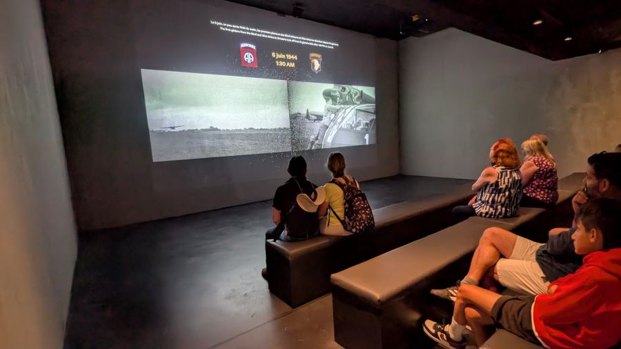 Half a dozen people sit in a small cinema auditorium watching a documentary about gliders
