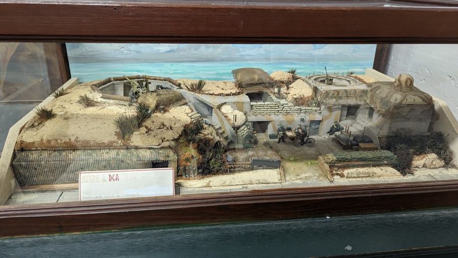 Detailed model of a German anti-aircraft bunker on the beach sand dunes