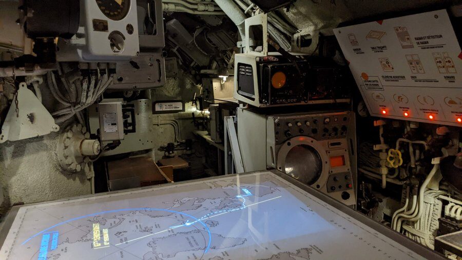 An illuminated chart table with machinery all around it