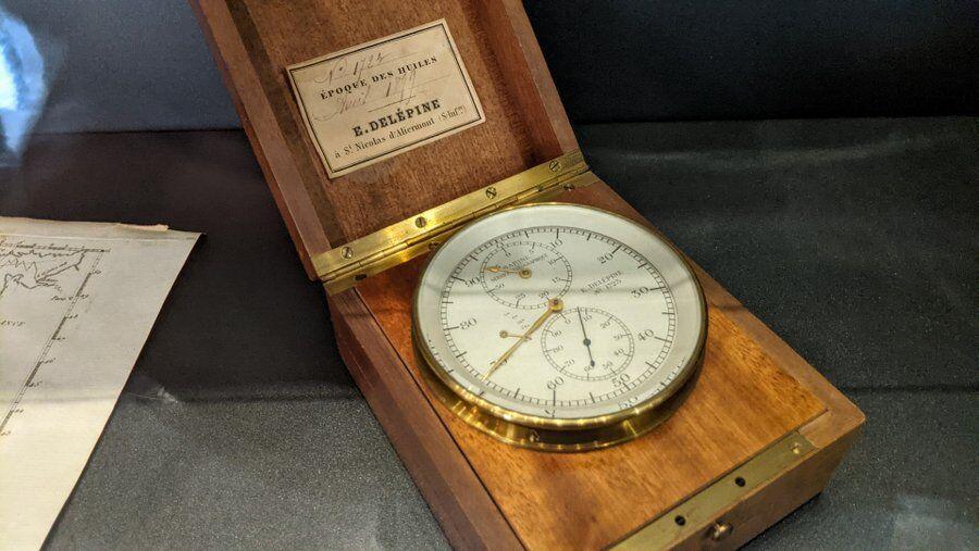 Brass chronometer in a mahogany case