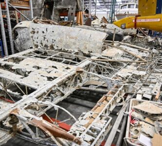 Corroded wreckage on a hanger floor