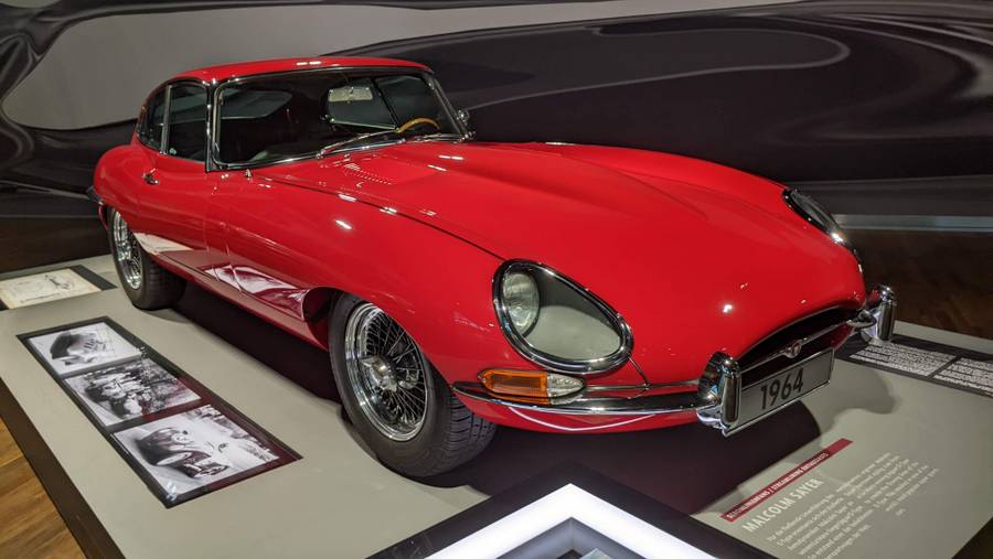 Red soft-top E-type Jaguar