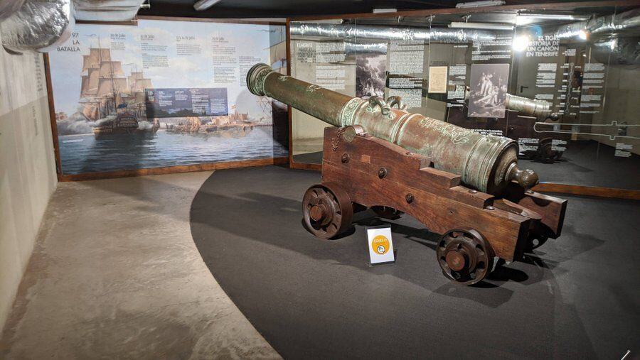 A large cannon in a museum display gallery