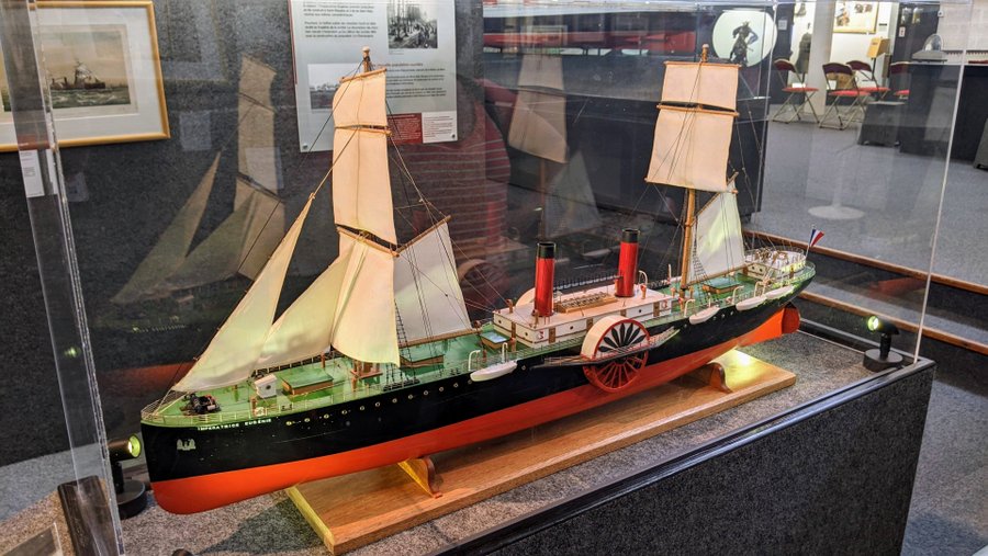 Model of a square-rigged iron hulled steamship with paddle-wheels