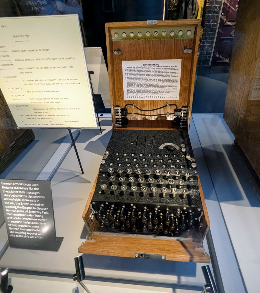 An Enigma machine, looks like a typewriter in a wooden box