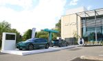 Two BYD cars under an electric charging stand