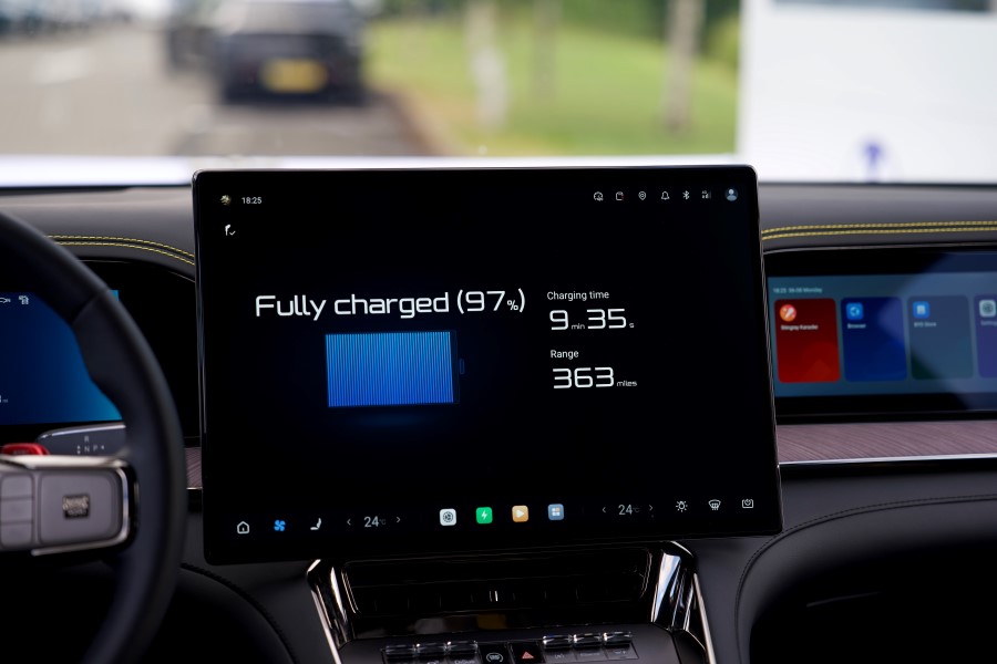 A display screen on the BYD Denza dashboard showing the charging details