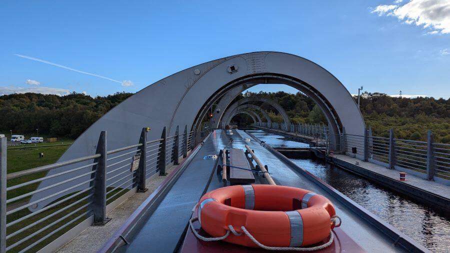 View forward over the narrowboat and along the Falkirk Wheel aqueduct