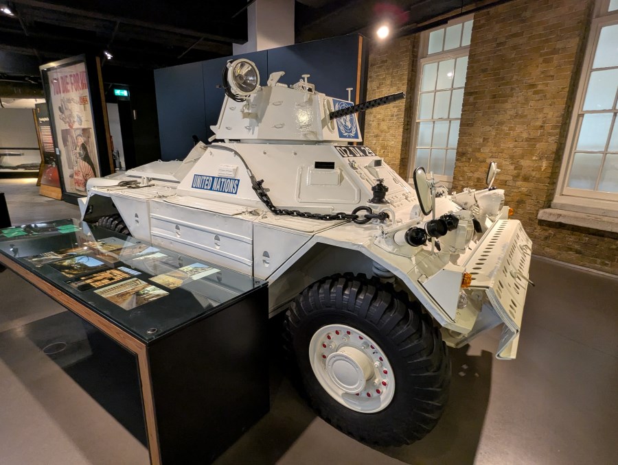 Small 4-wheel armoured scout car in United Nations white livery