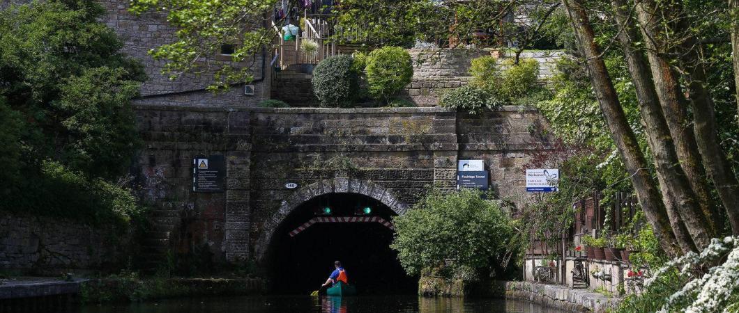 Canoeist enters the tunnel