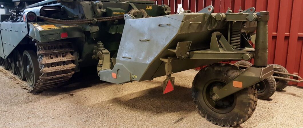 A wheeled trailer in army green