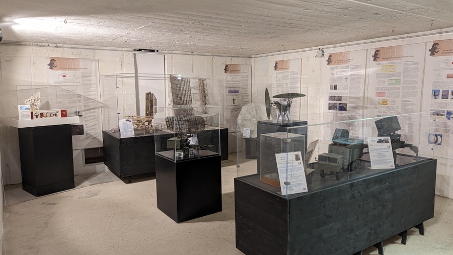 A room with display cases and information panels on the wall