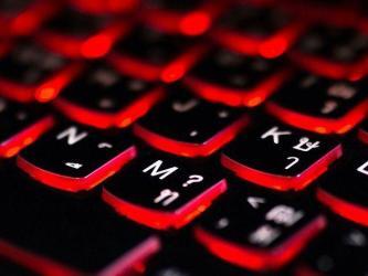Close up of a red backlit gaming keyboard