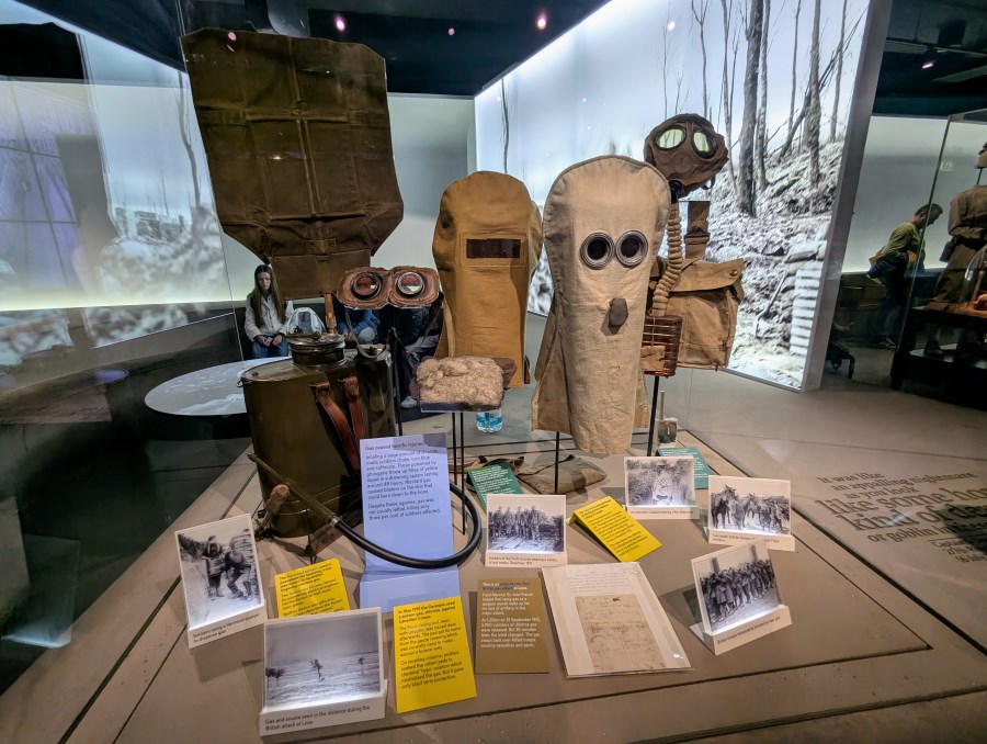 A display stand with various scary looking WW1 gas & smoke masks