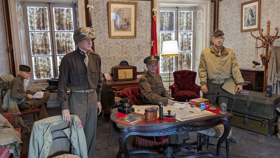Mannequins of the three generals, Eisenhower, Collins and Bradley with other soldiers in the room