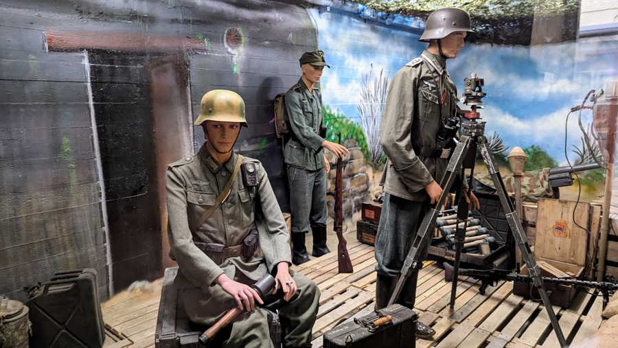 German soldiers in front of a beach defence bunker