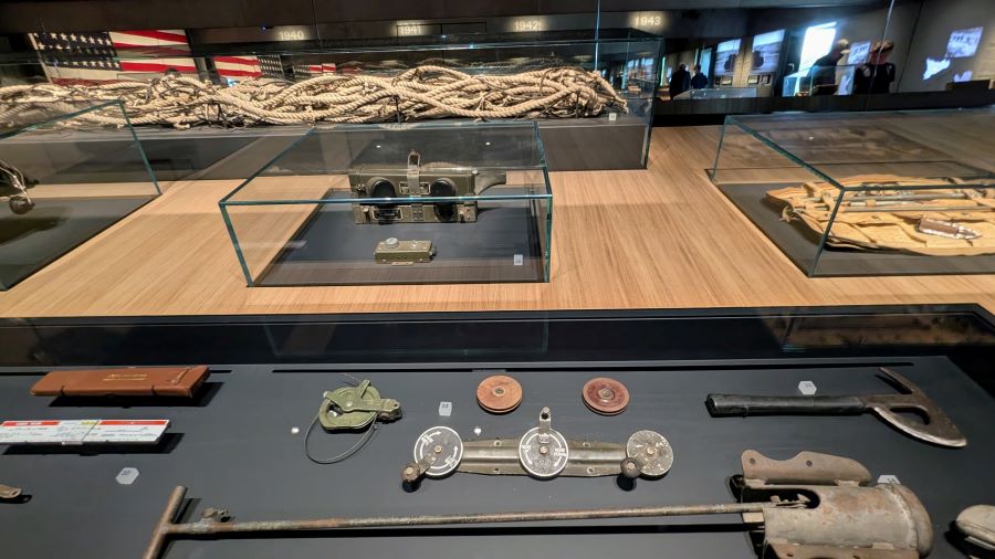 A close-up of some of the artefacts on display including a tow rope and Load Calculator (sliderule)