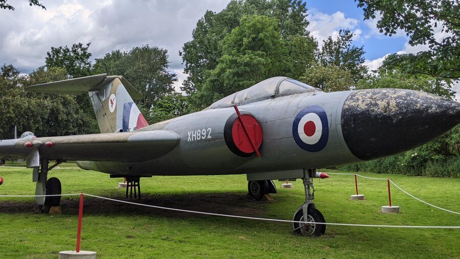 Front view of the Gloster Javelin, a large delta wing shaped aircraft in green and grey camouflage