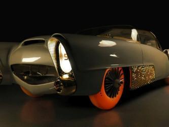 Futuristic grey-green coupe from the 1950s with bright orange tyres