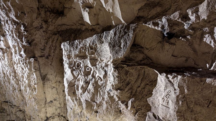 Graffiti etched into the walls of the tunnels