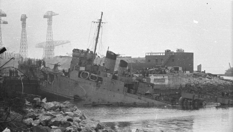 Black & White photo of HMS Campbeltown over the top of the dock gate