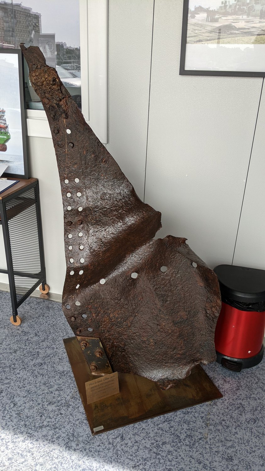 A jagged piece of bronze coloured metal about 1.2m high
