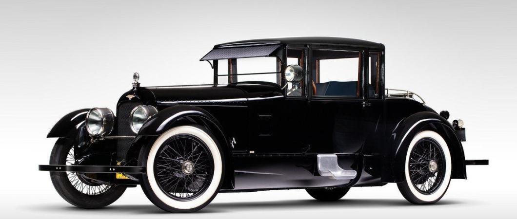Classic black car with white-walled tyres