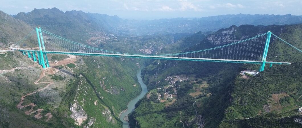 Aerial view of the huge Huajiang Grand Canyon suspension bridge and the valley below
